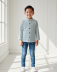 Lifestyle photo of Asian boy wearing navy striped Mao collar shirt with unbuttoned collar and jeans