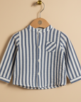 Product photo of navy gingham check shirt on beige background