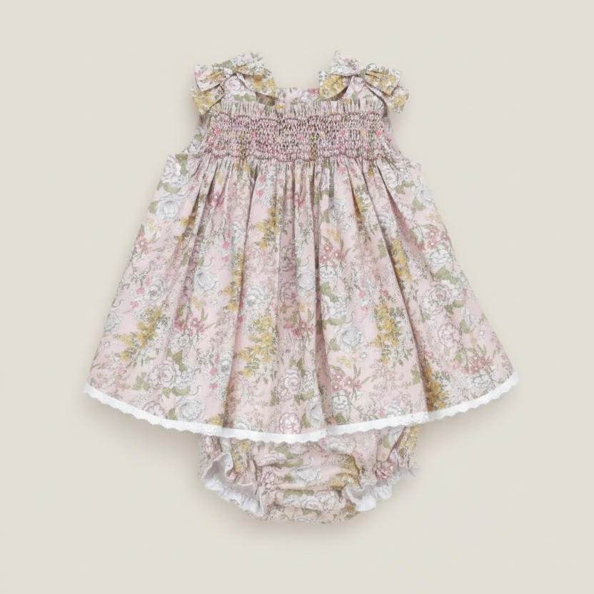 Professional product photo of floral dress and bloomers set on beige background