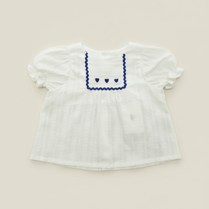 Professional white blouse flat lay